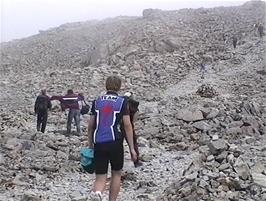 The upper reaches of the path start to get rockier in a strangely barren landscape
